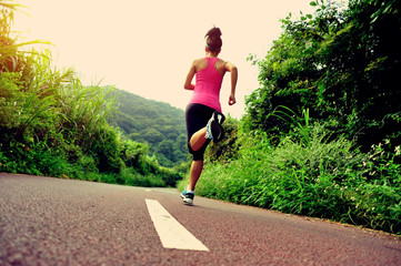 fitness woman runner running on trail