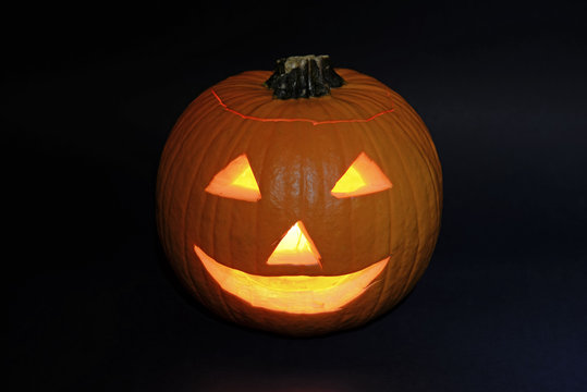 Halloween pumpkin carved into jack-o-lantern