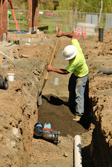 Trench Work worker in a utilities ditch