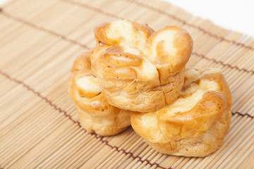 Loaf of bread on wooden plate