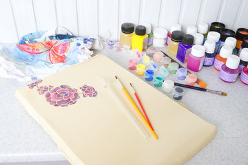 Batik process: artist paints on fabric, Batik painting