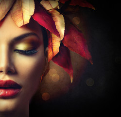 Autumn leaves hairstyle over dark background