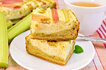 Pie with curd and rhubarb on tablecloth