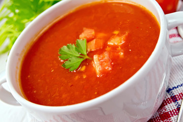 Soup tomato on napkin with parsley