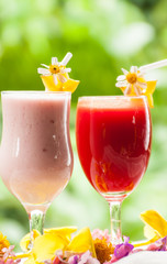 Close up strawberry yogurt and red cherry juice