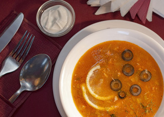 Russian dish solyanka with sour cream