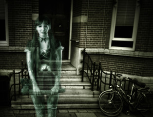 Scary woman ghost on porch of house