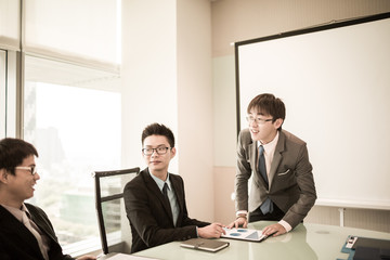 businessman giving a presentation to his colleagues