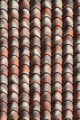 Striped ceramic tile roof close up. background vertical