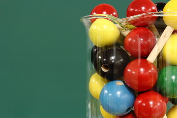 Molecular model: wooden balls in a beaker