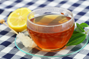 Cup of tea, sugar stick and lemon