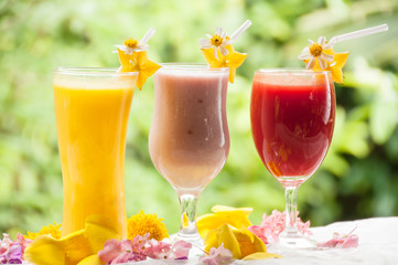 Mango juice strawberry yogurt and red cherry juice