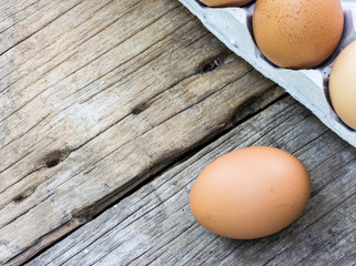 chicken egg on wood and chicken egg in panel eggs on wood