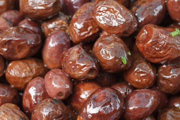 dark olives in oil close up.