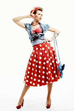 Pin-up young woman in vintage American style with a clutch