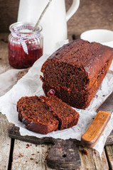Rustic chocolate cake with plum jam, selective focus