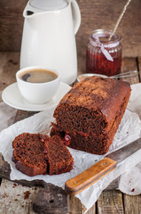 Rustic chocolate cake with plum jam, selective focus