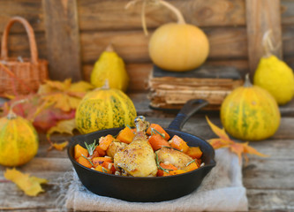 the baked chicken with pumpkin in a pig-iron frying pan