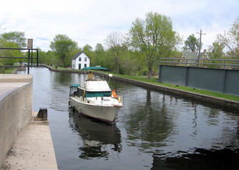Fototapeta na wymiar Rideau Canal Merrickville boat before lock 2008