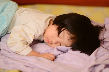 Obraz na płótnie Canvas Sleeping Asian child.