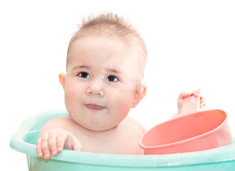 Child bathing in a basin