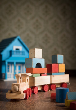 Wooden toy train and doll house
