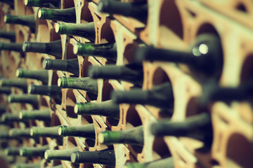 Wine cellar bottles covered with dust