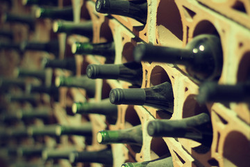 Wine cellar bottles covered with dust