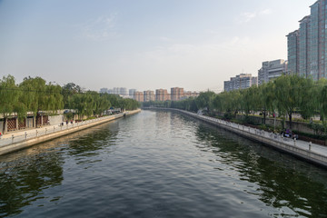 Obraz premium China, Beijing. City landscape with the river and quay