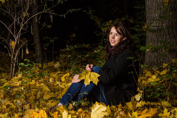 Young woman in night park