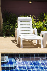 Swimming pool with lounge chair