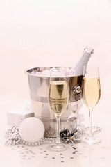 Two champagne glasses, Christmas ball, gift