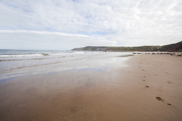 Fototapeta na wymiar Footprints in the sand coastal image