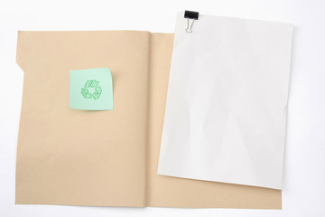 A manila file folder with a clipping path and a recycle sign