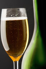 Wine glass and Bottle, isolated on black background.