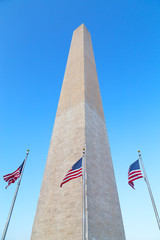Washington Monument with flags of United States