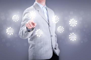 businessman on the virtual keyboard sends email