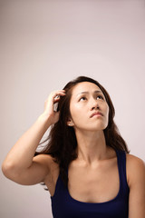 Fototapeta premium Asian chinese lady feeling puzzled