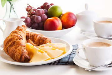 Naklejka na ściany i meble Croissants with cheese, fruits and coffee