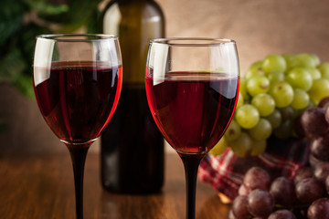 Glasses of red wine and bottle