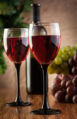 Glasses of red wine and bottle