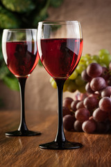 Glasses of red wine and bottle