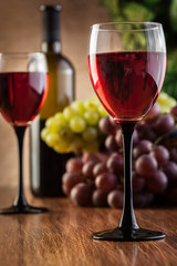 Glasses of red wine and bottle