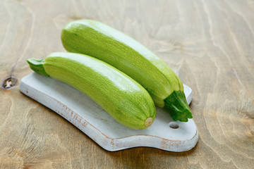two zucchini on a cutting board