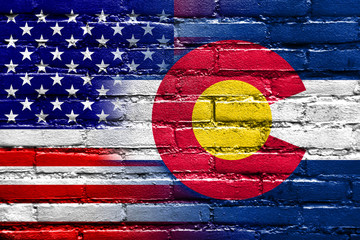 USA and Colorado State Flag painted on brick wall