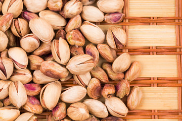 Close up of tasty pistachios on table.