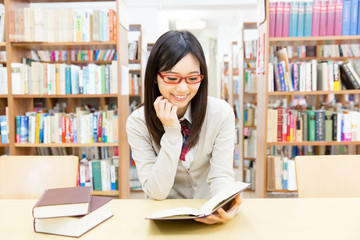 young asian student in the library