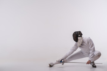 Young woman engaging in fencing