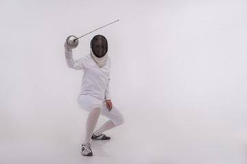 Young woman engaging in fencing