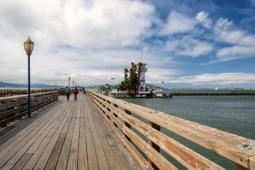 Fotobehang Wooden pier with a beacon in the San Francisco gulf. © lucky-photo